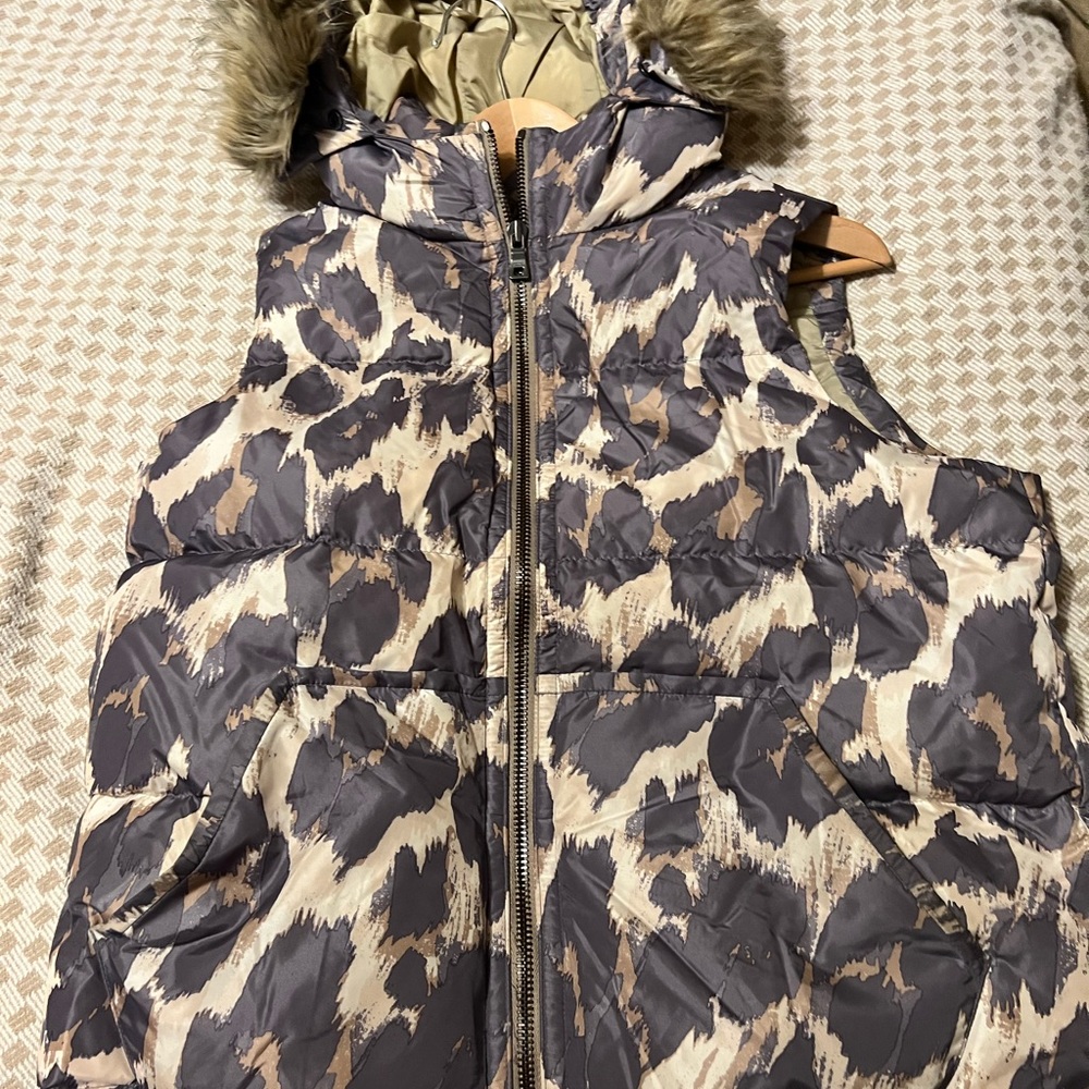 Coach size medium puffer vest, leopard print with a faux fur hood.
